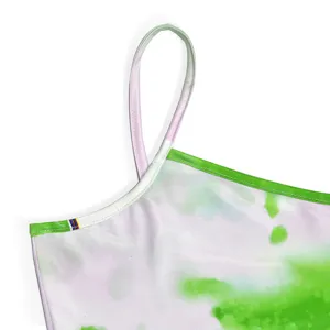 Close-up detail of women's sexy tie-dye camisole dress strap and neckline design.