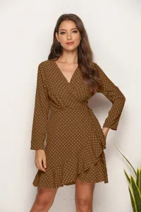 Detail view of a sexy brown polka dot wrap dress featuring a chic ruffle irregular hemline.