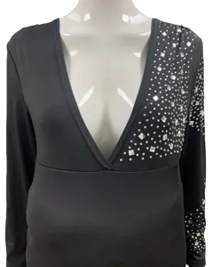 Detail shot of black long sleeve V-neck maternity dress with rhinestone shoulder and sleeve decor.