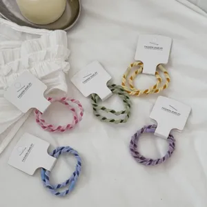 Candy color twisted braided hair ties, elastic hair ropes for girls, cute styling detail view.