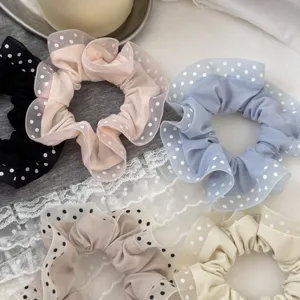 Detail view of sweet polka dot hair scrunchies with delicate lace trim, multi-color set.