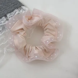 Sweet polka dot scrunchie with delicate lace detail, cute hair tie accessory for women.