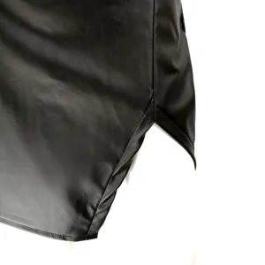 Black high waist PU leather skirt side slit detail close up view fashion apparel trend