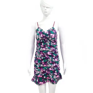 Floral ruched bodycon mini dress detail showing spaghetti straps and vibrant purple print fabric.