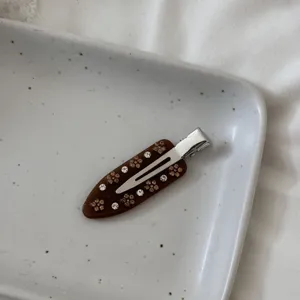 Exquisite brown rhinestone acetate hair clip detail shot, elegant french style side bang clip for women.