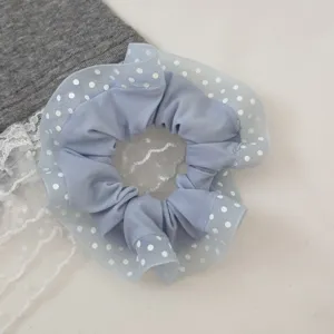 Sweet polka dot hair scrunchie with delicate lace overlay, perfect for styling cute ponytails.