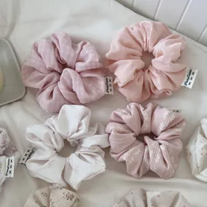Korean style pink floral hair scrunchies set, elegant fabric hair accessories for women.