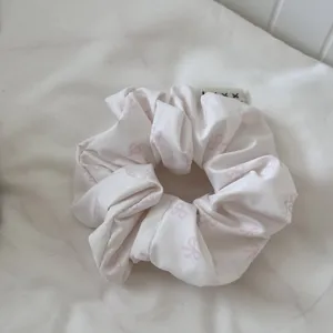 Korean style pink floral scrunchie for women, cute bow print hair tie for daily hair styling.