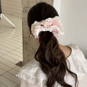 Pink lace hair scrunchie for women, sweet fairy ponytail holder, cute hair tie accessory.