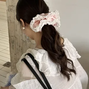 Pink lace hair scrunchie for women, sweet fairy style ruffled hair tie ponytail accessory.