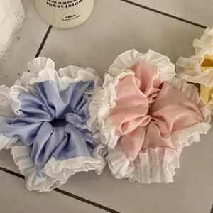 Sweet satin hair scrunchies with white lace ruffles, fashionable ponytail holders for daily wear.