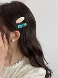 Resin oval hair clips with shell elements, sweet style side hairpins, chic hair accessories for women.