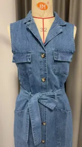 Sleeveless denim dress for women, featuring lapel collar, single-breasted buttons, and waist belt.
