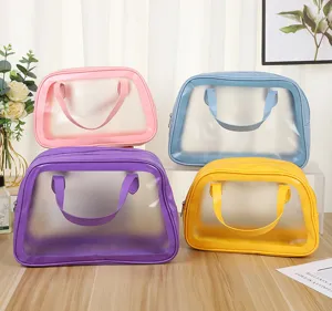Clear waterproof PVC cosmetic bag set in candy colors with handles for travel and beach.