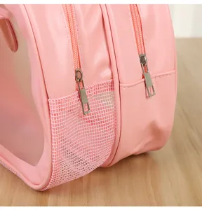 Pink PVC cosmetic bag detail shot with double zippers and mesh pocket for beach travel.