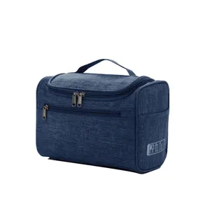 Trousse de toilette de voyage portable en tissu oxford avec poignée et compartiments.