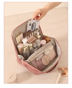 Detailed view of large capacity velvet travel makeup bag with multiple brush slots and mesh pockets.