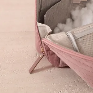 Pink velvet portable makeup bag main view showcasing interior compartments and smooth zipper design.