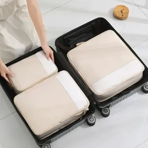 Portable travel packing cubes set, luggage organizers bags for clothes, underwear, and essentials.