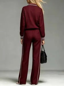 Women's casual maroon tracksuit set featuring long sleeves, lapel collar, and white stripes.