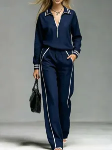 Women navy blue tracksuit set with white piping, long sleeve top and pants detail showcase