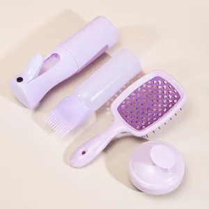 Purple hair care set with spray bottle, oiling bottle, cushion brush and scalp massage brush.