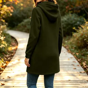 Outdoor autumn scene detail showcasing a casual dark green fleece long hooded sweatshirt back.