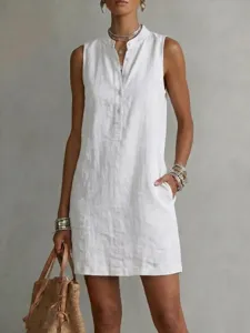 Detailed view of women's sleeveless linen dress with front buttons and side pockets.