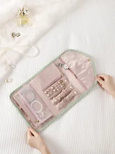 Travel fold portable jewelry organizer roll bag with faux leather and pink velvet interior
