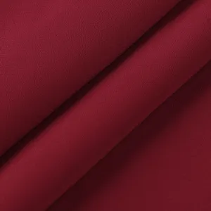 Burgundy nursing wear fabric detail, soft fine textured material close up view for clothing.