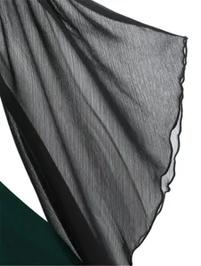 Close-up detail of black sheer bell sleeve with gothic ruffle edge, lightweight fabric texture shot.