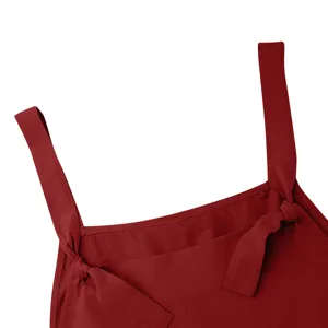 Wine red overall detail shot featuring adjustable knotted straps and premium fabric design.