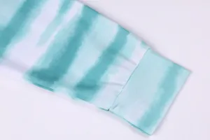 Close-up detail of women's long sleeve tie-dye gradient top and ribbed cuff design.