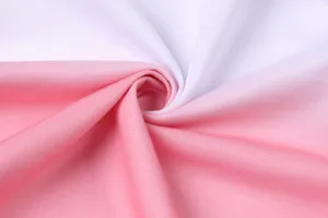 Close-up detail of white and pink gradient fabric showing soft and smooth textile texture.