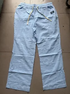 Men's casual light blue cotton linen loose straight pants with comfortable drawstring design.