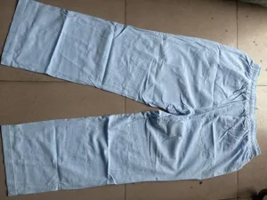 Men casual light blue loose straight linen long pants detail showing elastic waist and soft fabric
