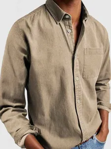 Close-up detail of mens khaki long sleeve cotton casual shirt with chest pocket and button front.