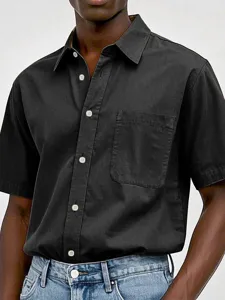 Close-up view of men's short sleeve casual shirt in washed cotton with chest pocket button detail