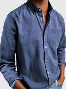 Detailed view of the blue washed cotton casual long-sleeve shirt with a front chest pocket.