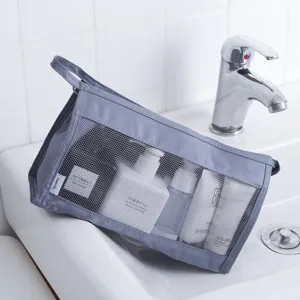 Grey mesh travel toiletry bag, large capacity portable cosmetic organizer pouch for women.