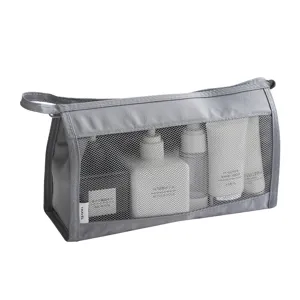 Grey mesh travel cosmetic bag, large capacity portable makeup organizer and toiletry pouch.