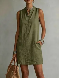 Casual sleeveless linen dress detail, solid color button front, side pockets, summer chic.