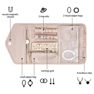 Travel folding jewelry organizer roll bag with secure magnetic closure and ring rolls.