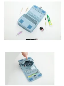 Detailed view of the blue hanging toiletry bag showing multiple compartments and sturdy hook.