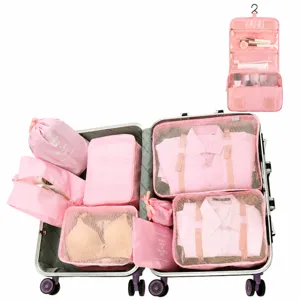 Pink travel storage bags packing cubes set for luggage organization and portable packing.
