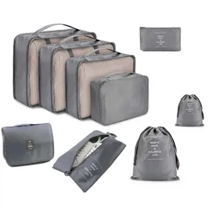 9-piece travel packing cubes set, portable gray luggage organizers for clothes and shoes.