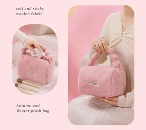 Soft plush handbag detail showing cozy woolen fabric texture and unique bubble handle design.