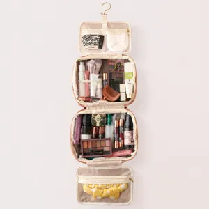 Hanging toiletry bag with multiple compartments, foldable travel makeup organizer for women.