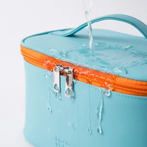 Large capacity portable cosmetic bag in light blue with orange zipper waterproof main view