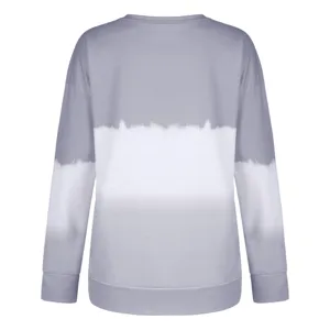 Detailed view of the gradient tie-dye long sleeve crewneck sweatshirt fabric and hem.
